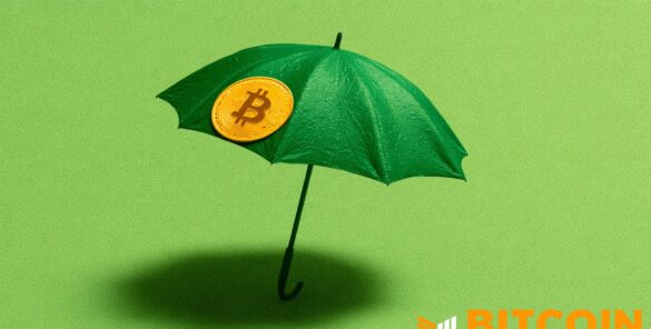 Gold Bitcoin coin resting on an open umbrella, symbolising Bitcoin life insurance and protection
