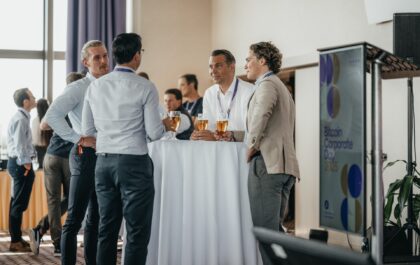 Bitcoiners networking at tables at BTC Prague 2026