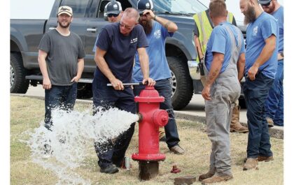 Workers at a fire hydrant in El Reno after a 3 million gallon leak